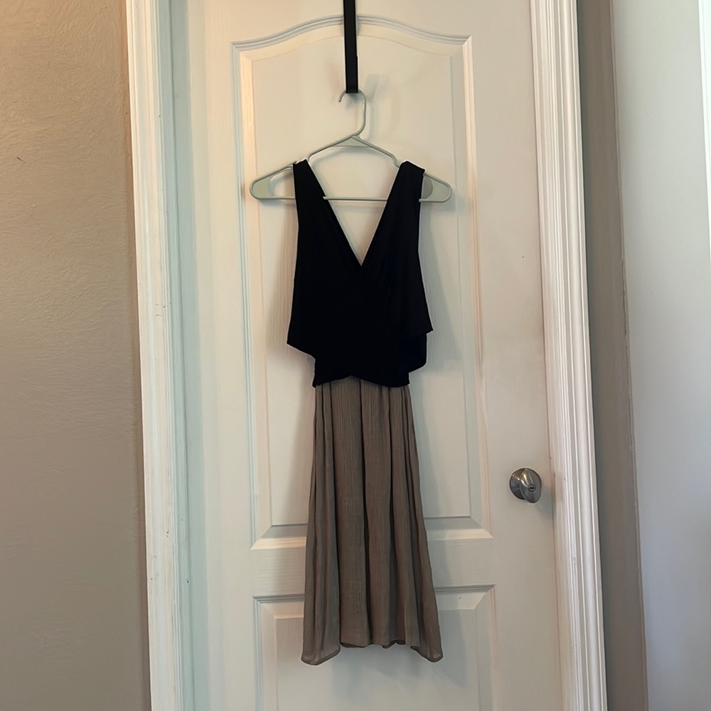 Anthropology dress, sleeveless dress & black with dark cream color bottom.